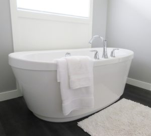 bathtub clogged with grout