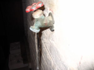 outdoor faucet backing up into basement
